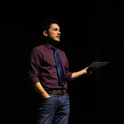 Faculty Dr. Nathan Bowman teaching on stage